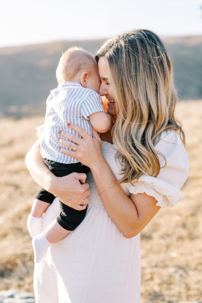 Baby snuggling with baby at Bishop Peak family photos by San Luis Obispo Family Photographer Austyn Elizabeth Photography 