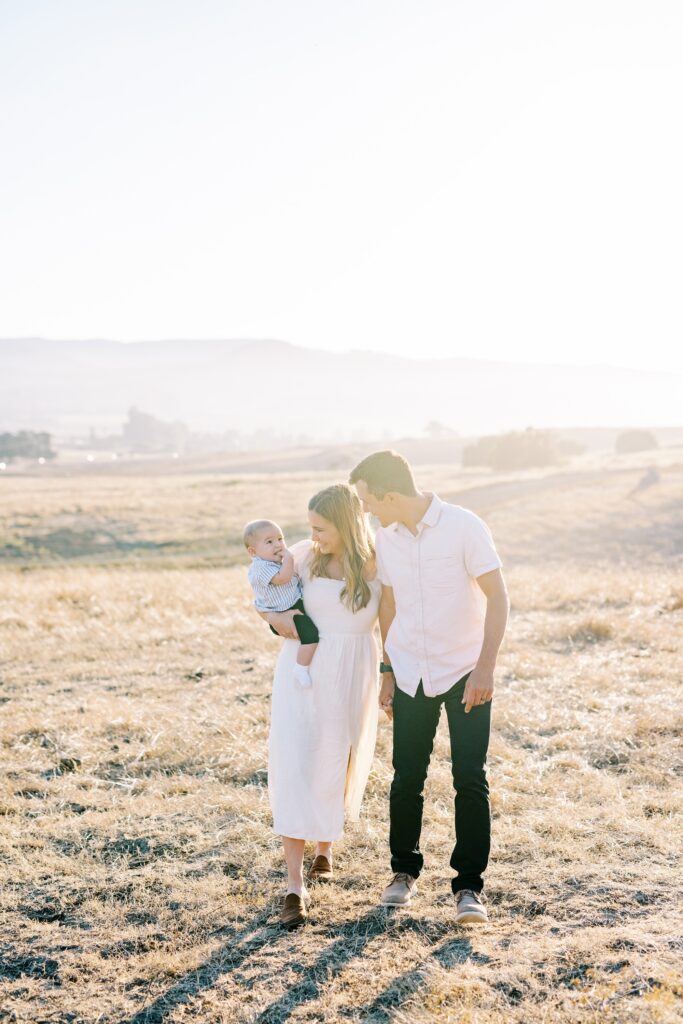Family walking in the field during Bishop Peak family photos by San Luis Obispo Family Photographer Austyn Elizabeth Photography 