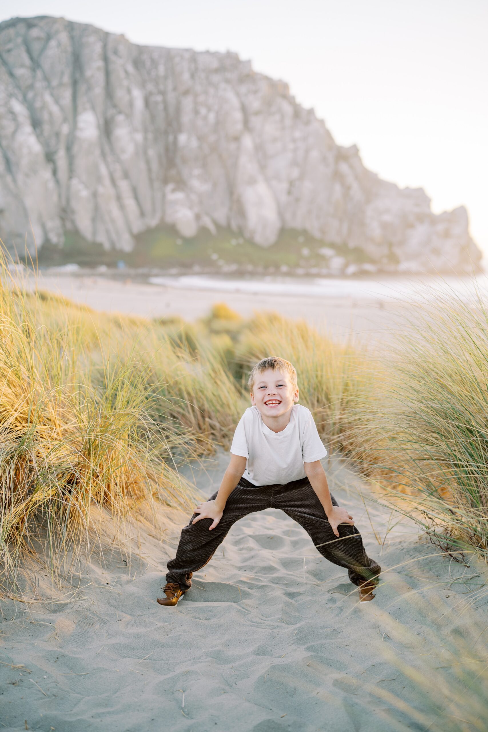 eight year old portraits in front of morro rock by Morro Bay Family Photographer Austyn Elizabeth Photography